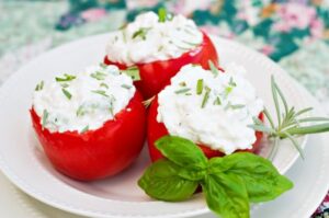 Cheese-Stuffed Tomatoes with Yogurt Herb Sauce